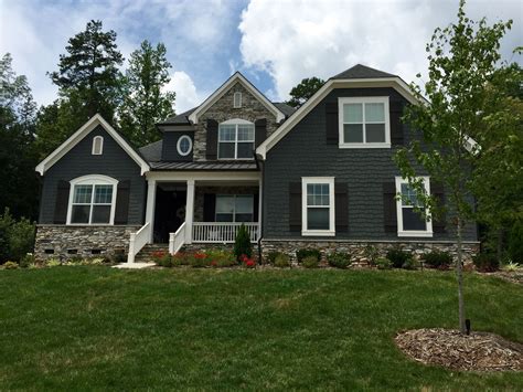 grey house blue metal roof|gray exterior with black trim.